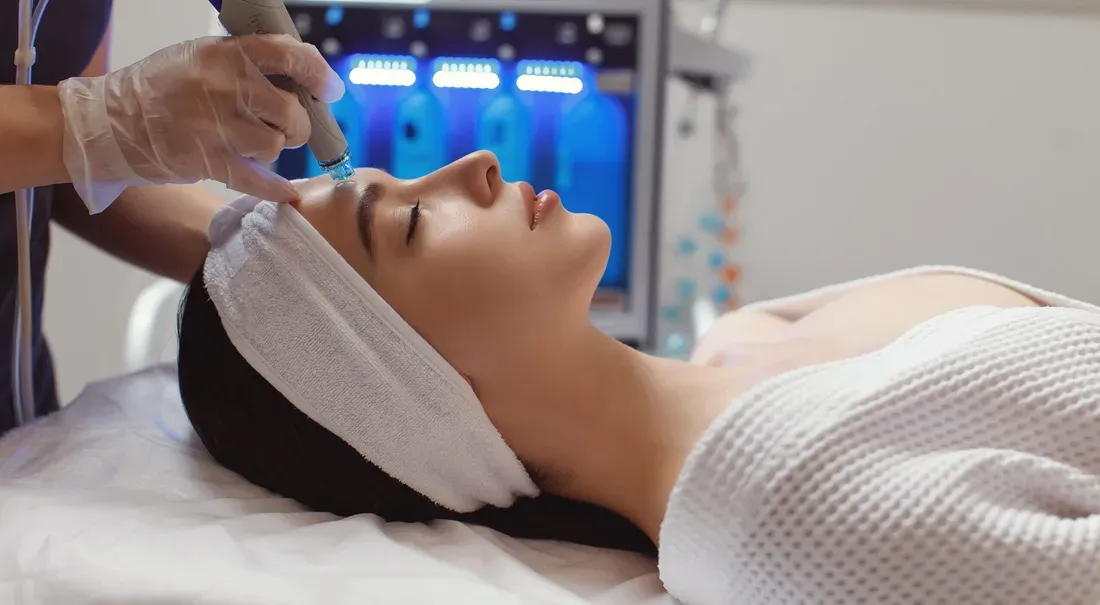 Woman receiving a facial treatment
