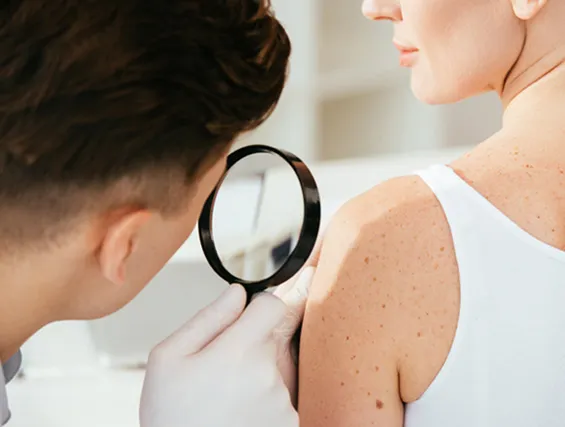 Palm Beach Dermatology Group dermatologist analyzing patient skin.