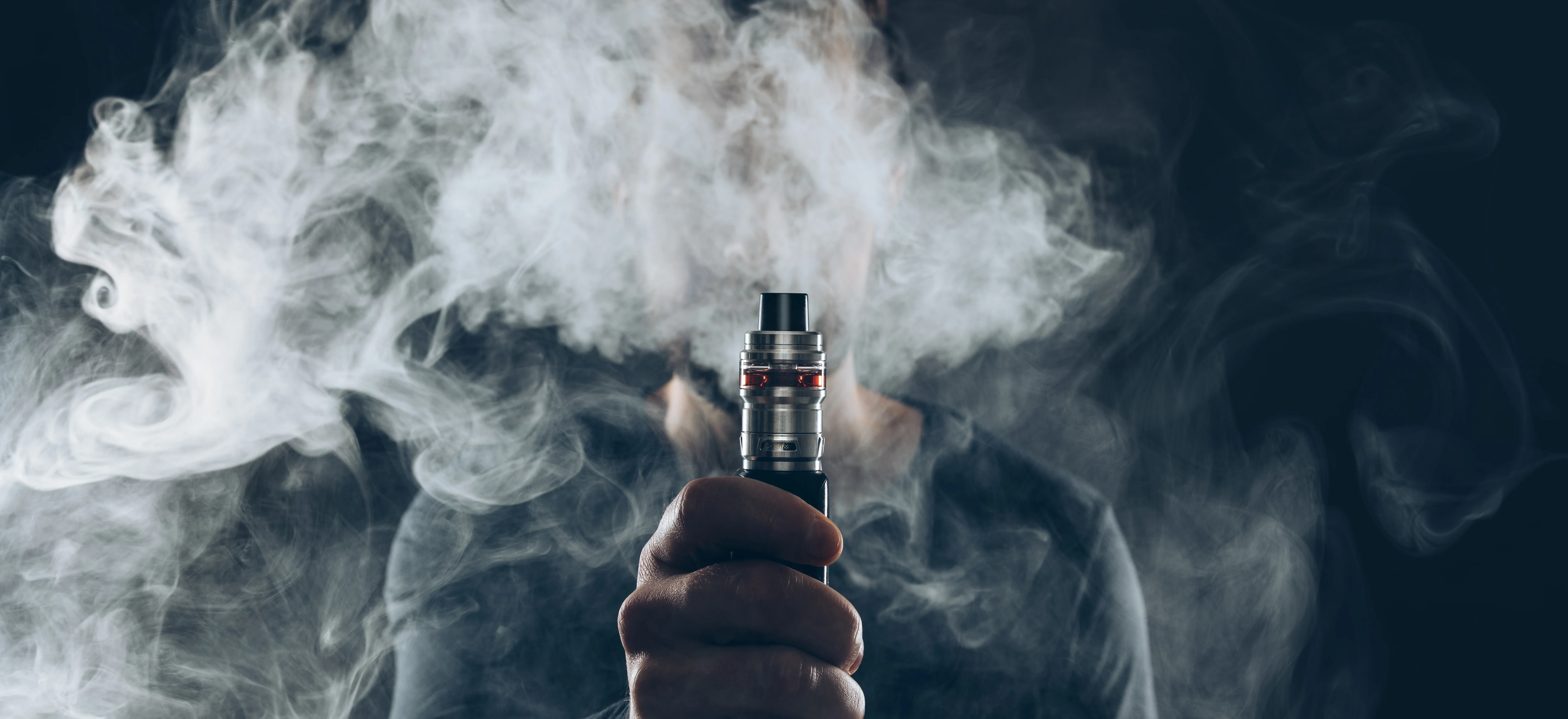 Vaping flavored e-liquid from an electronic cigarette - Does Vaping Cause Acne? - Palm Beach Dermatology Group