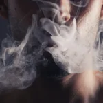 smoke cloud face man with pollution marijuana smoker health campaign with zoom cannabis weed cbd addiction model smoking habit lifestyle advertising black studio - Does Smoking Weed Cause Acne? A Simple Guide - Palm Beach Dermatology Beach