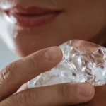 woman cooling skin with ice facial therapy - Does Ice Help Acne or Make It Worse? - Palm Beach Dermatology Group