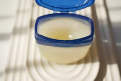 Close up of petroleum jelly in a container - Is Vaseline Good for Eczema? Benefits, Drawbacks & Best Ways To Use it - Palm Beach Dermatology Group