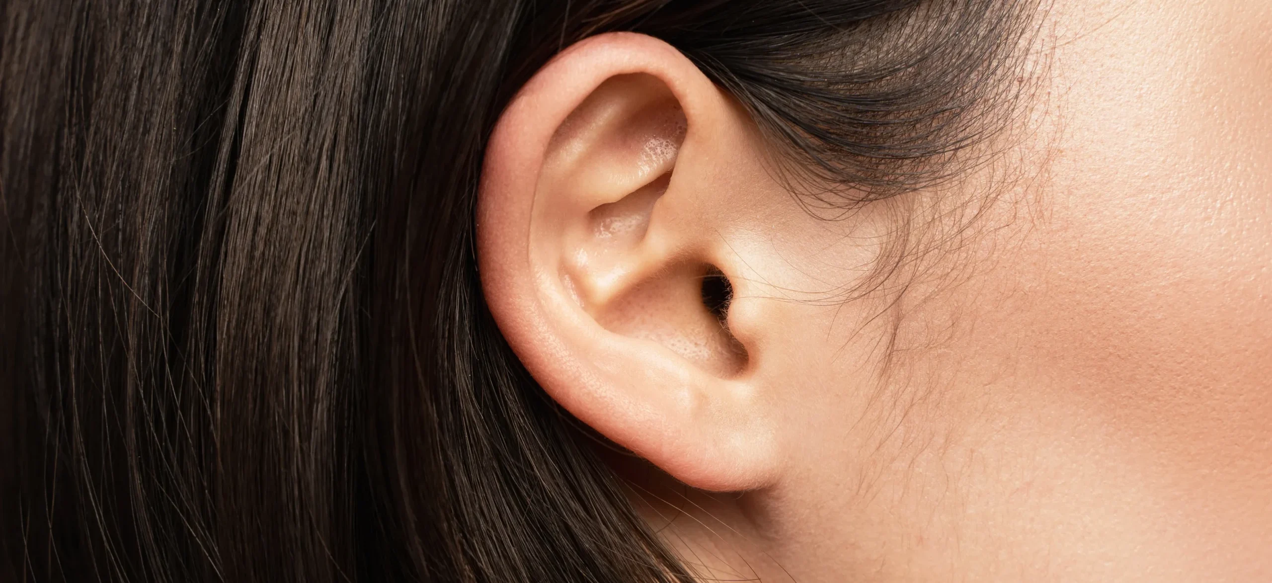 close up view of caucasian female ear - Blackheads in Ear: Causes, Symptoms, Safe Removal, Treatment, and Prevention
