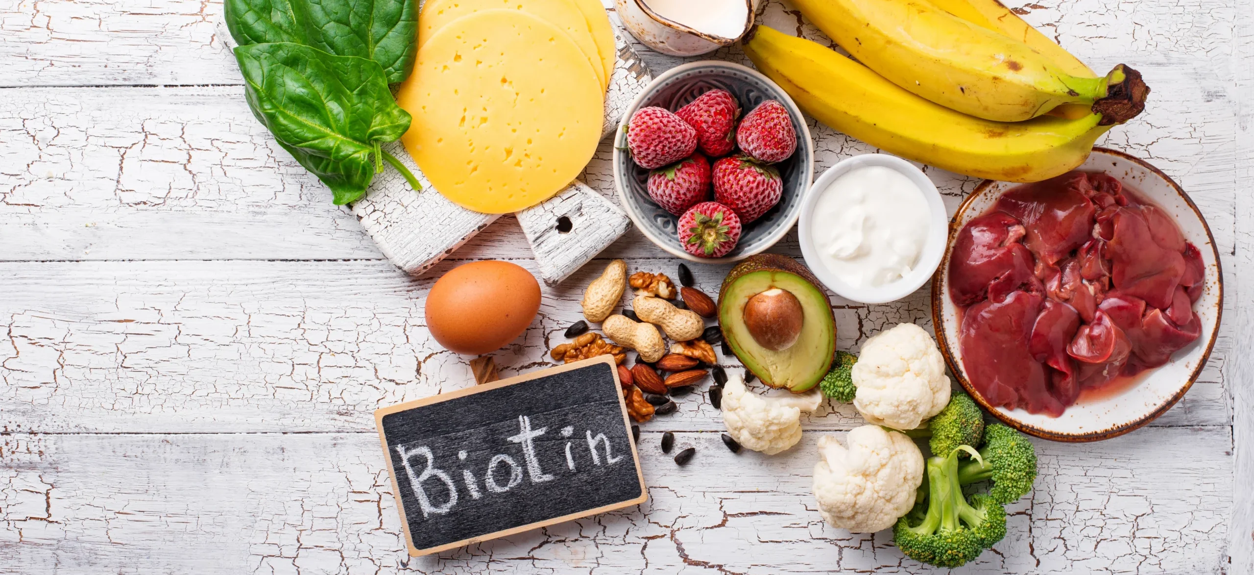 Can Biotin Cause Acne? Everything You Need to Know - high biotin food on white wooden background